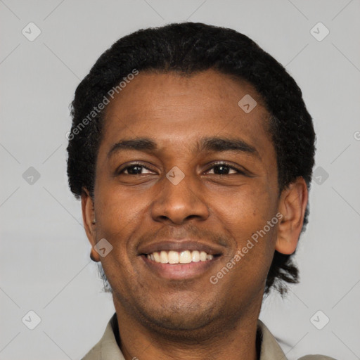 Joyful latino young-adult male with short  black hair and brown eyes