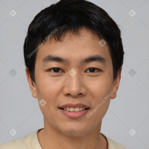 Joyful asian young-adult male with short  black hair and brown eyes