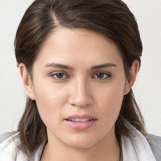 Joyful white young-adult female with medium  brown hair and brown eyes