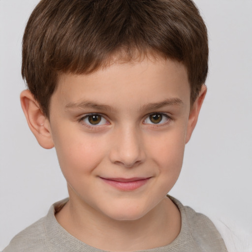 Joyful white child male with short  brown hair and brown eyes