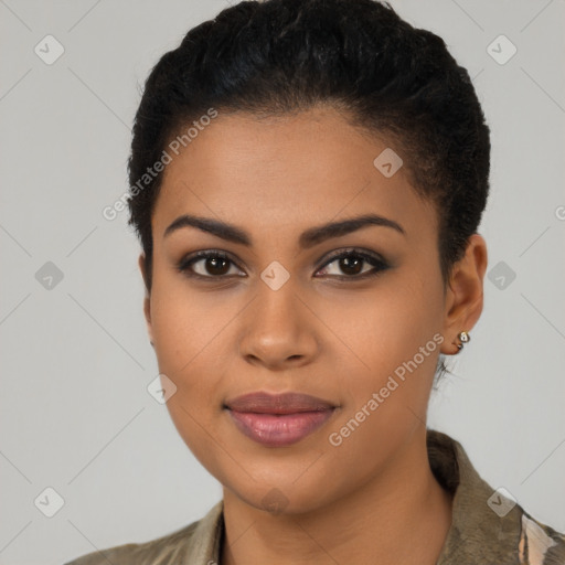 Joyful latino young-adult female with short  black hair and brown eyes