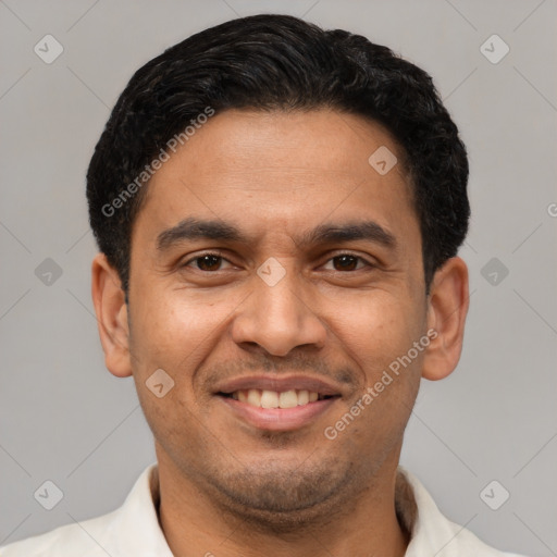 Joyful latino young-adult male with short  brown hair and brown eyes