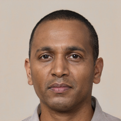 Neutral black adult male with short  black hair and brown eyes