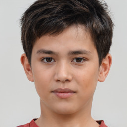 Joyful white child male with short  brown hair and brown eyes