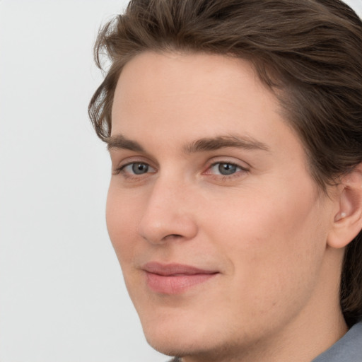 Joyful white young-adult male with medium  brown hair and brown eyes