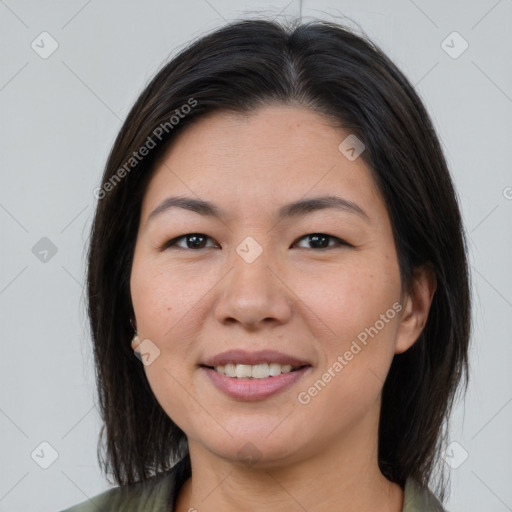 Joyful asian young-adult female with medium  brown hair and brown eyes