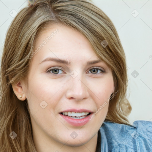 Joyful white young-adult female with long  brown hair and blue eyes