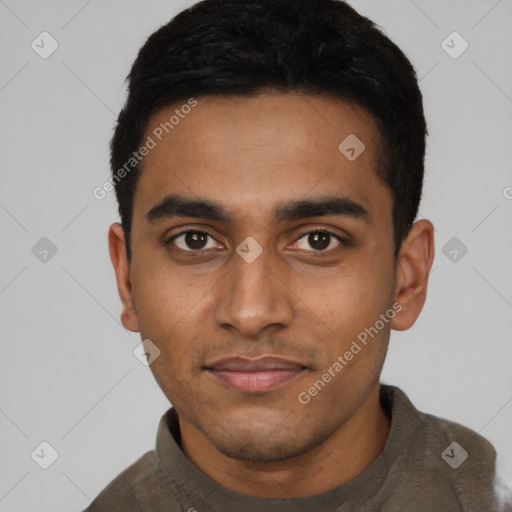 Joyful black young-adult male with short  black hair and brown eyes