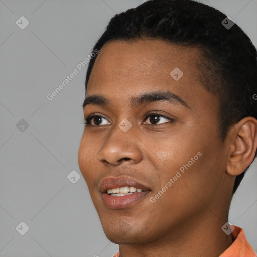 Joyful black young-adult male with short  black hair and brown eyes