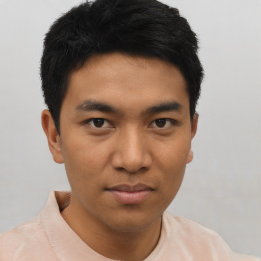 Joyful asian young-adult male with short  black hair and brown eyes