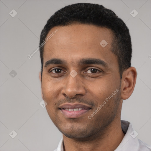 Joyful latino young-adult male with short  black hair and brown eyes