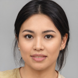 Joyful asian young-adult female with medium  brown hair and brown eyes