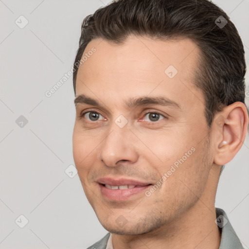 Joyful white young-adult male with short  brown hair and brown eyes