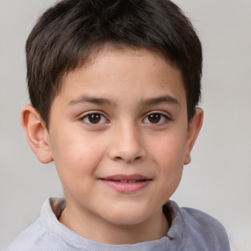 Joyful white child male with short  brown hair and brown eyes