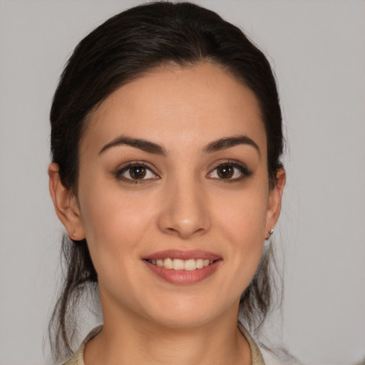 Joyful white young-adult female with medium  brown hair and brown eyes