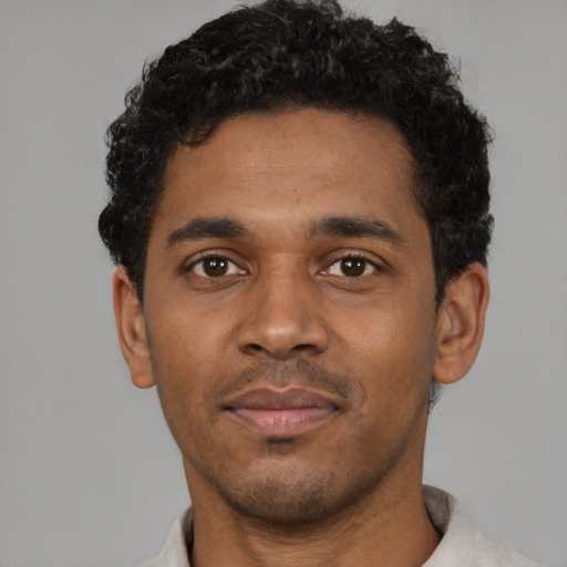 Neutral black young-adult male with short  black hair and brown eyes