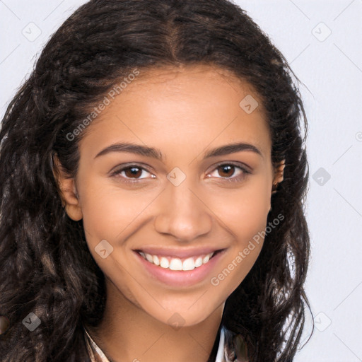 Joyful latino young-adult female with long  brown hair and brown eyes