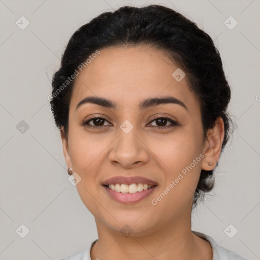 Joyful latino young-adult female with short  black hair and brown eyes