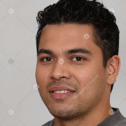 Joyful white young-adult male with short  black hair and brown eyes