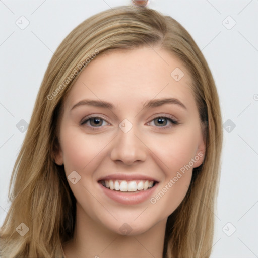 Joyful white young-adult female with long  brown hair and grey eyes