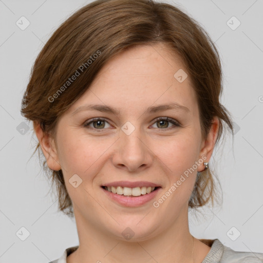 Joyful white young-adult female with medium  brown hair and grey eyes