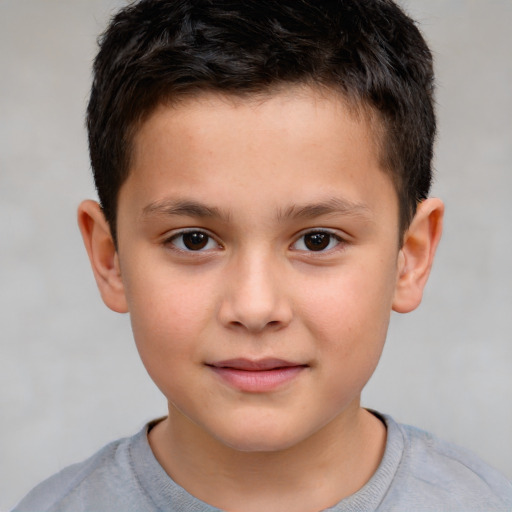 Joyful white child male with short  brown hair and brown eyes