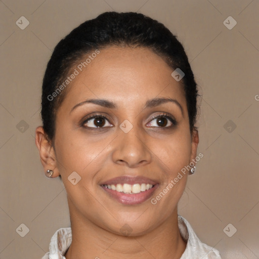 Joyful latino young-adult female with short  black hair and brown eyes