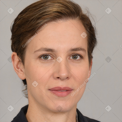 Joyful white adult female with medium  brown hair and grey eyes