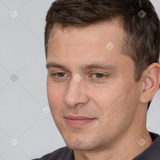 Joyful white adult male with short  brown hair and brown eyes