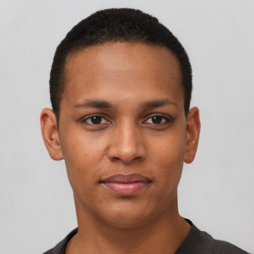 Joyful black young-adult male with short  black hair and brown eyes