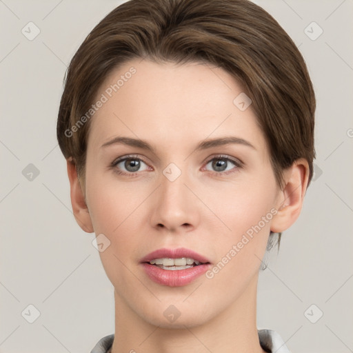 Joyful white young-adult female with short  brown hair and grey eyes