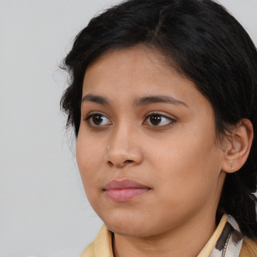 Neutral latino young-adult female with medium  brown hair and brown eyes