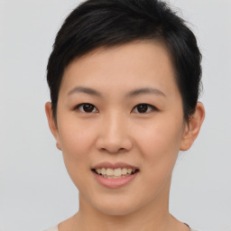 Joyful asian young-adult female with short  brown hair and brown eyes