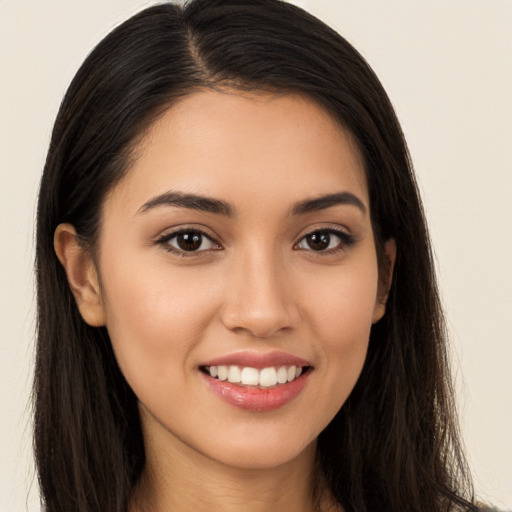 Joyful white young-adult female with long  brown hair and brown eyes