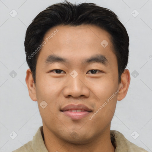 Joyful asian young-adult male with short  black hair and brown eyes