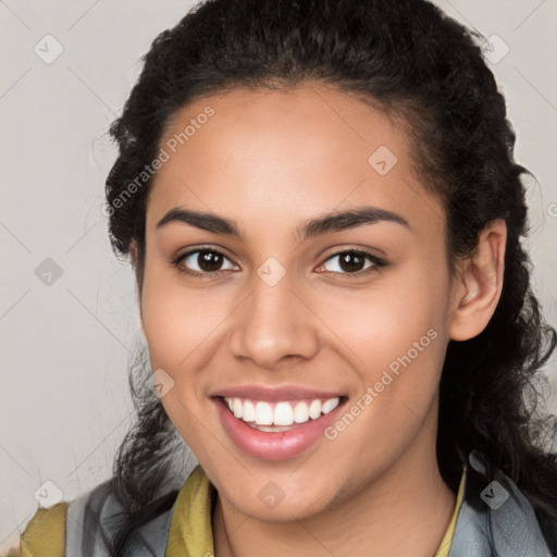 Joyful latino young-adult female with long  brown hair and brown eyes