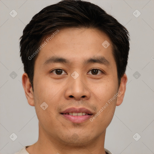 Joyful asian young-adult male with short  brown hair and brown eyes