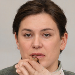 Joyful white adult female with short  brown hair and grey eyes