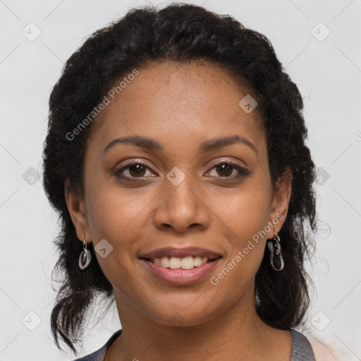 Joyful black young-adult female with long  brown hair and brown eyes