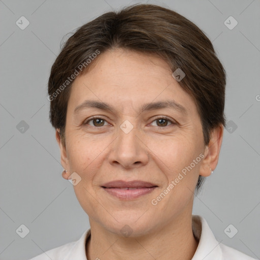 Joyful white adult female with short  brown hair and brown eyes