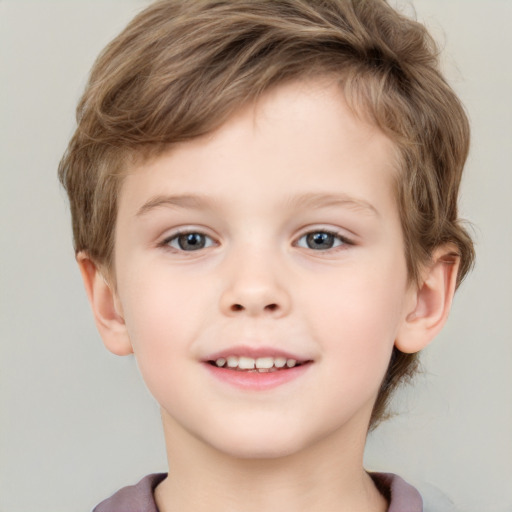 Joyful white child male with short  brown hair and grey eyes