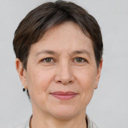 Joyful white adult female with short  brown hair and brown eyes