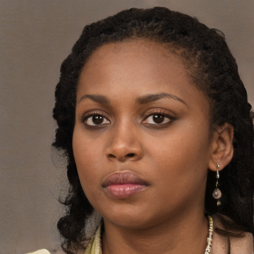 Neutral black young-adult female with long  black hair and brown eyes