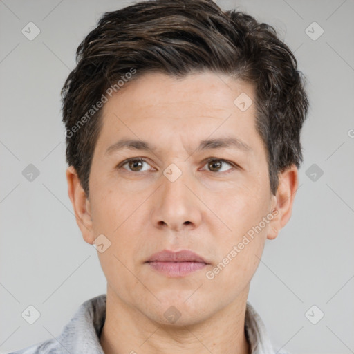 Joyful white adult male with short  brown hair and brown eyes