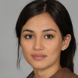 Neutral asian young-adult female with medium  brown hair and brown eyes