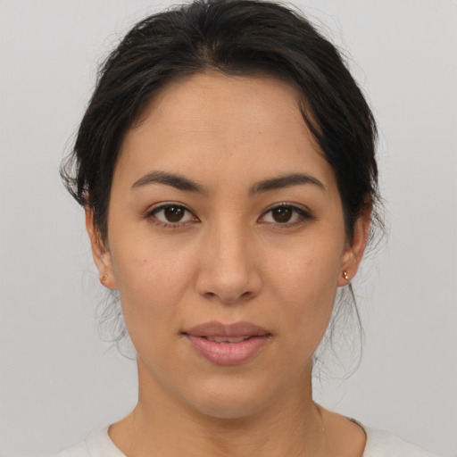 Joyful asian young-adult female with medium  brown hair and brown eyes