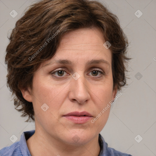 Joyful white adult female with medium  brown hair and blue eyes