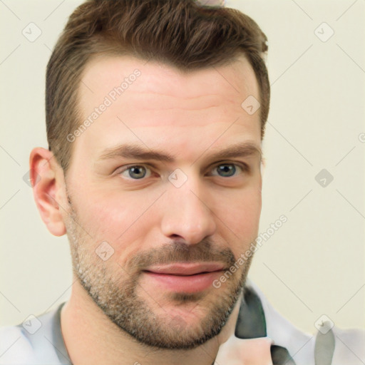 Joyful white young-adult male with short  brown hair and brown eyes