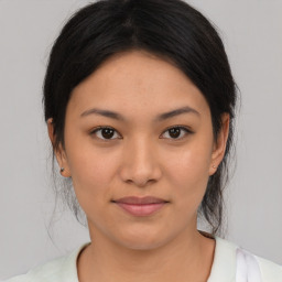 Joyful asian young-adult female with medium  black hair and brown eyes