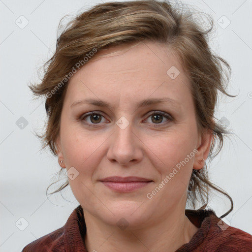 Joyful white adult female with medium  brown hair and blue eyes